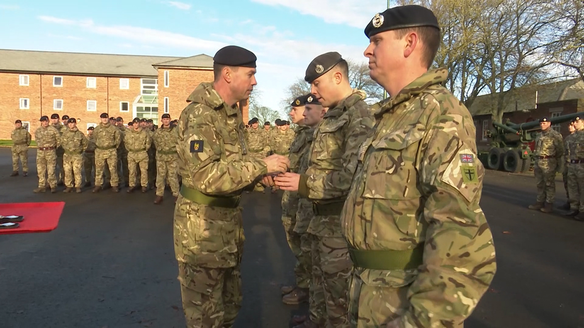 Soldiers being handed the medal.