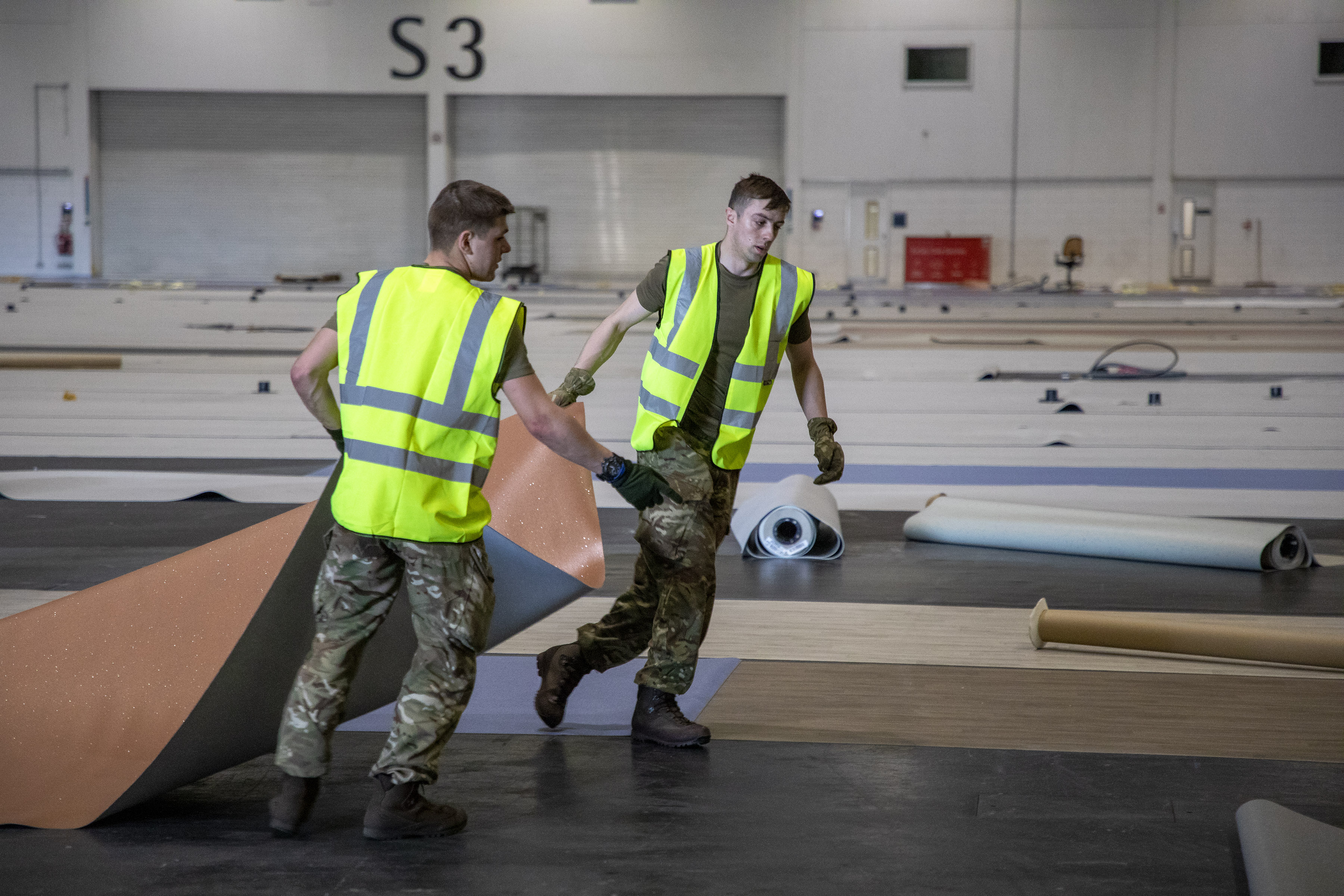 Cover image: Soldiers help to build London's NHS Nightingale facility (Picture: MOD).