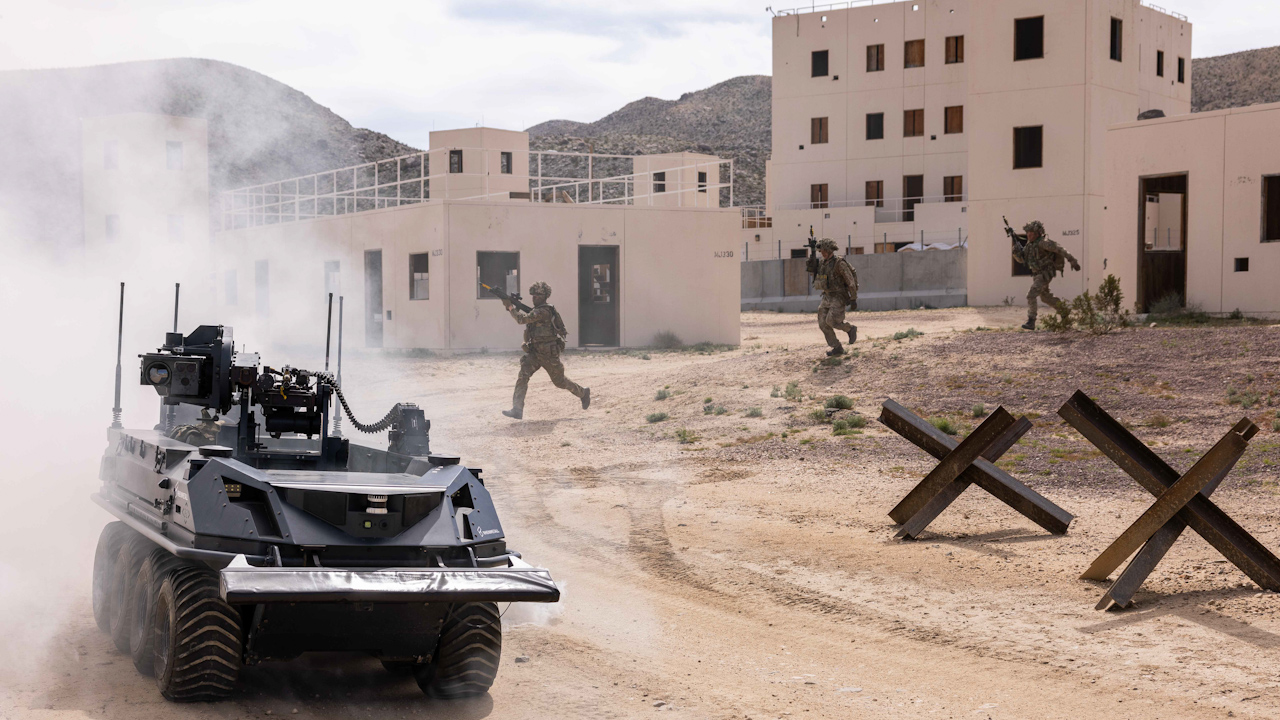 Soldiers from 2nd Battalion The Royal Yorkshire Regiment move from building to building while being covered by an autonomous RPV (Robotic Platoon Vehicle) with a mounted machine gun (Picture: British Army)