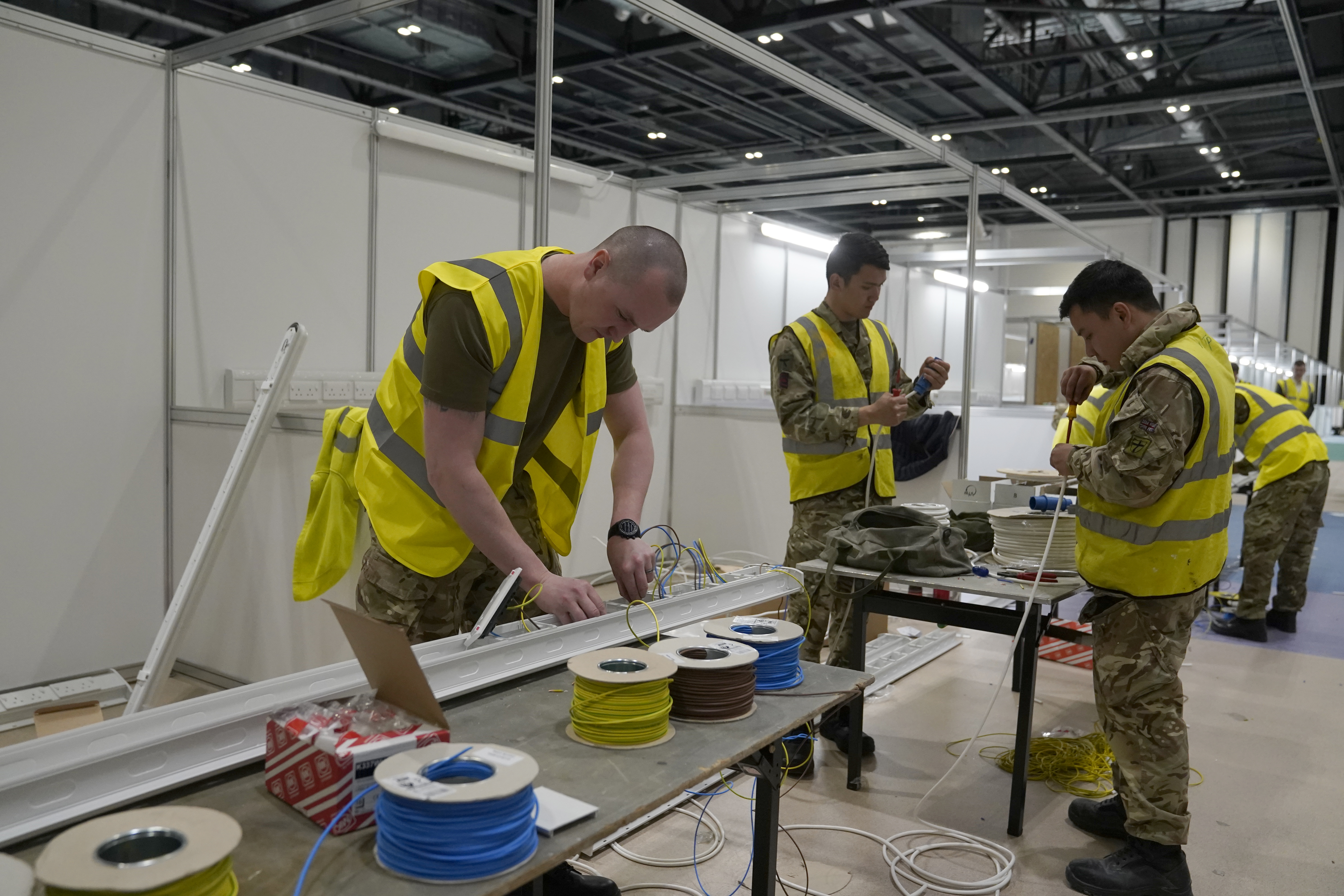 Cover image: Soldiers help work together to build NHS Nightingale (Picture: Number 10/Flickr).