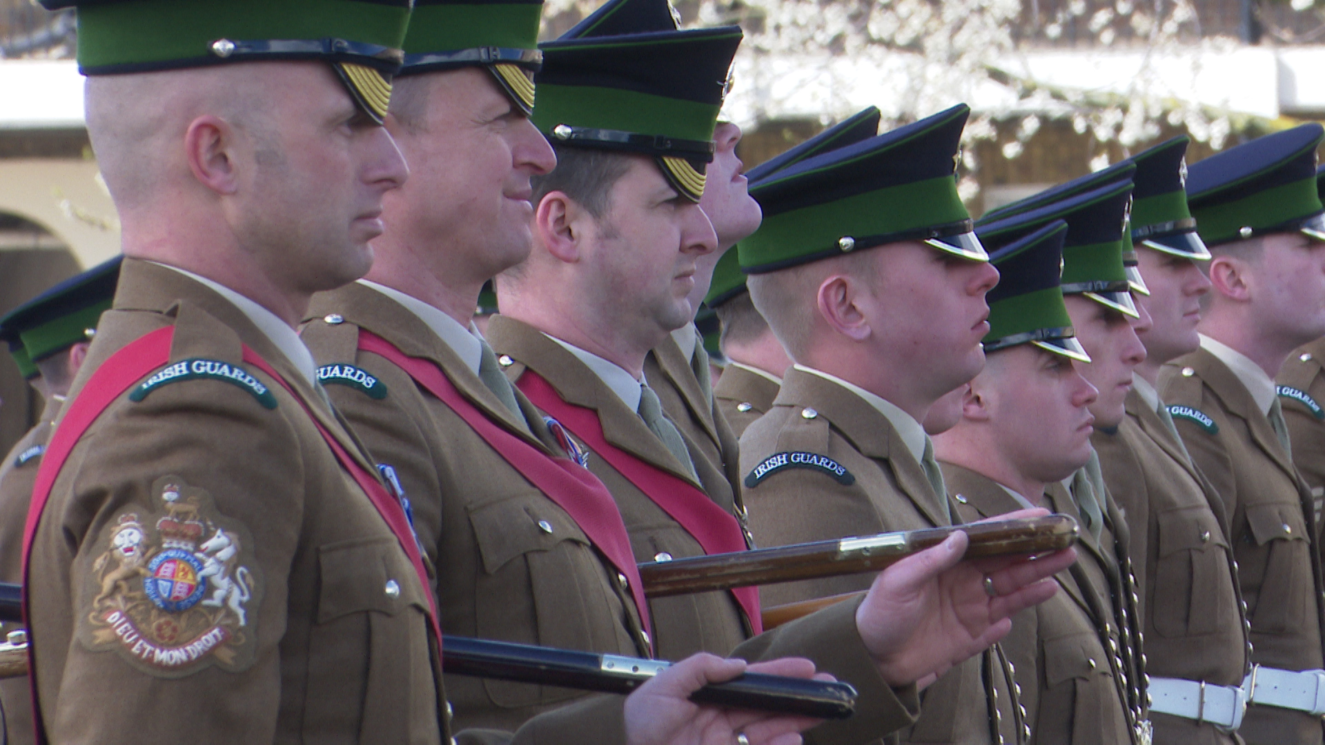Soldiers from the Irish Guards observe a minute of silence.