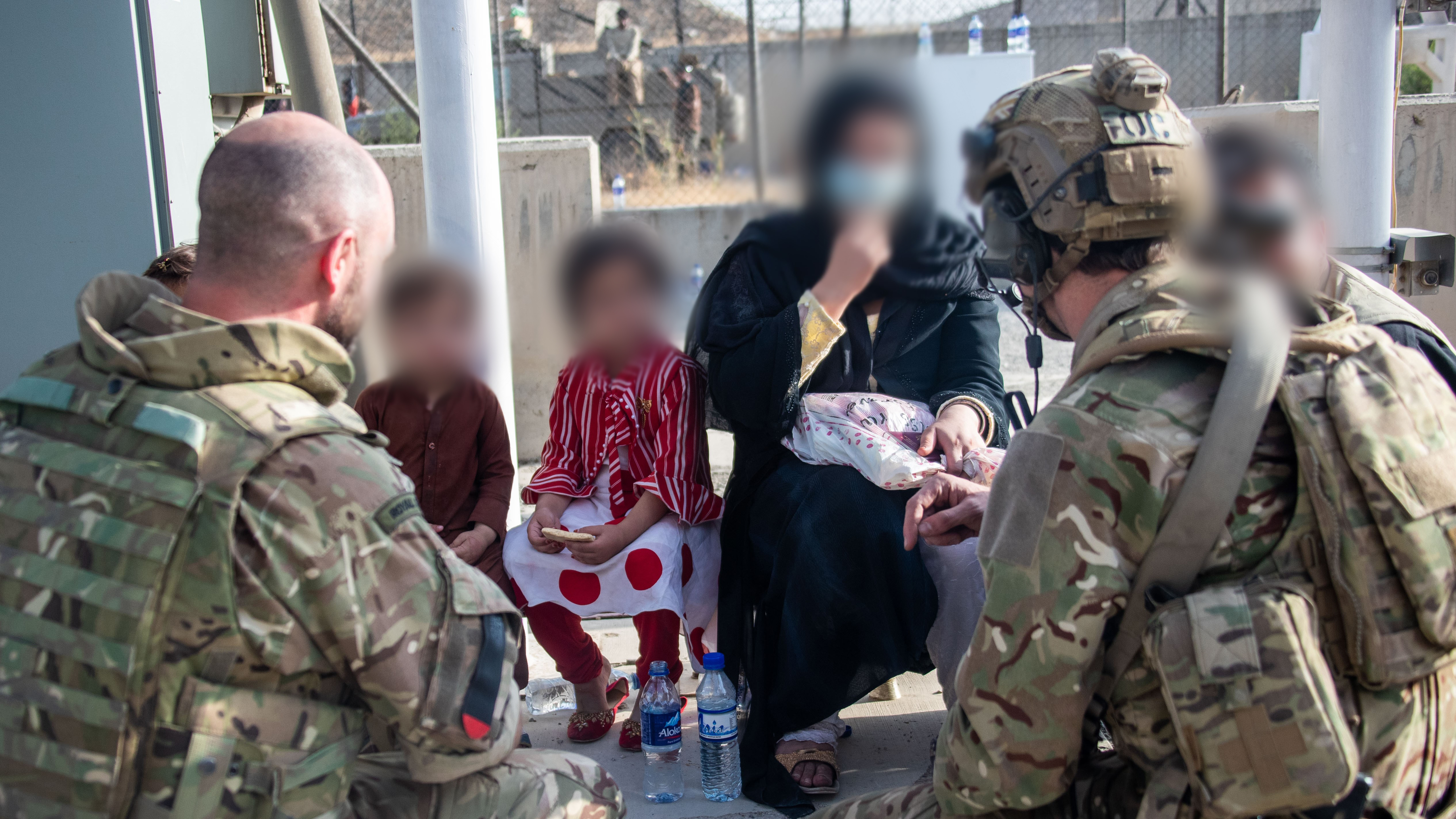 UK personnel talking with Afghan families during Operation Pitting in August (Picture: MOD).