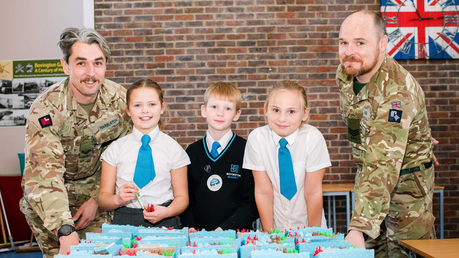 Soldiers and students pack boxes together CREDIT Deborah Johnson