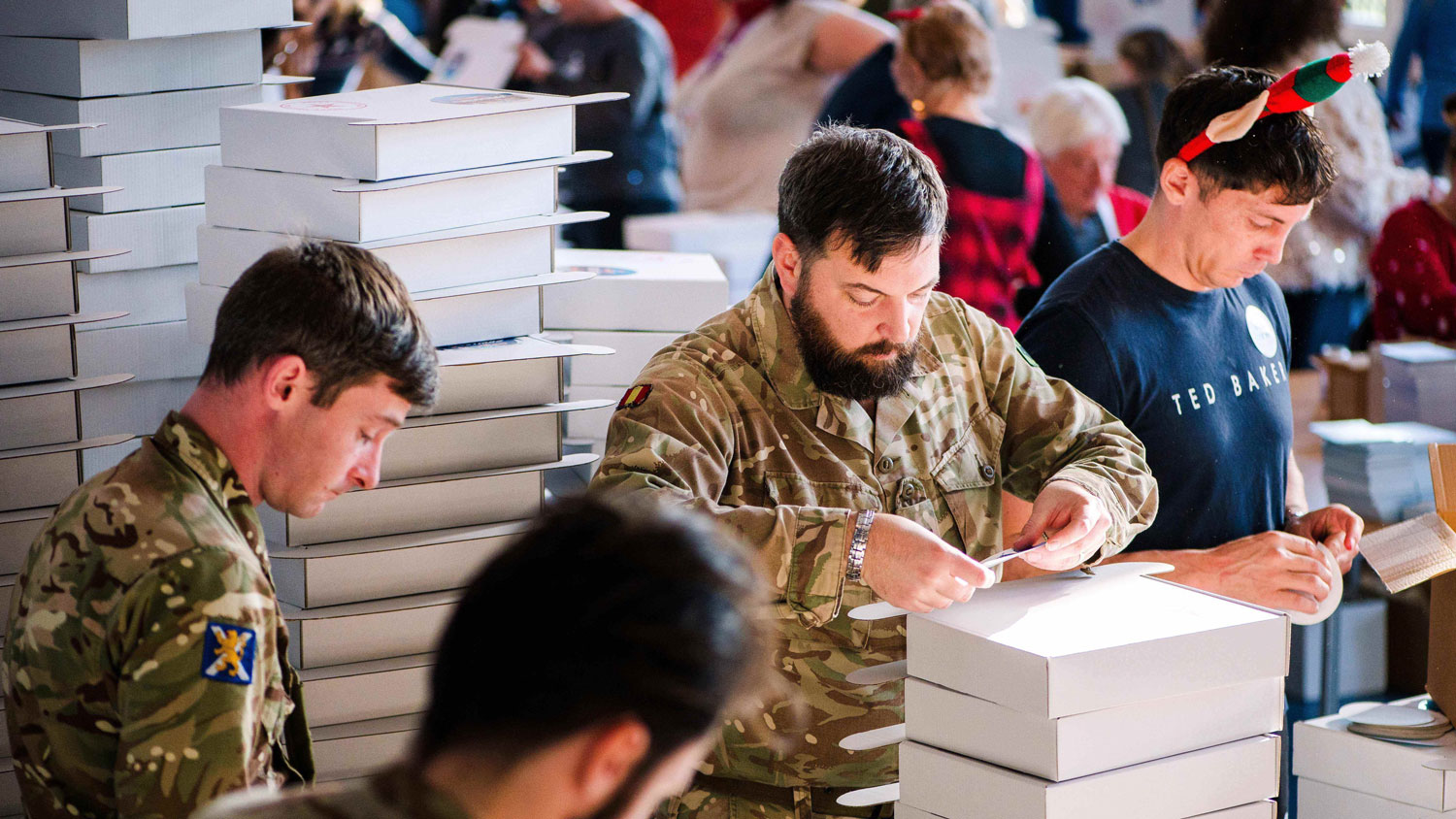 Soldiers in Bovington help pack Christmas Smiles boxes 2 CREDIT Deborah Johnson