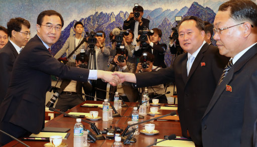 South Korean Unification Minister Cho Myoung-gyon shakes hands with Ri Son-gwon, chairman of North Korea's Committee for the Peaceful Reunification of the Country (Picture: PA).