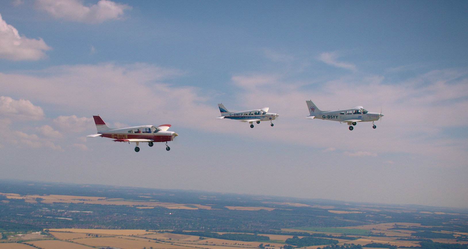 Spitfire Sir Douglas grandson with disabled pilots CREDIT SWNS