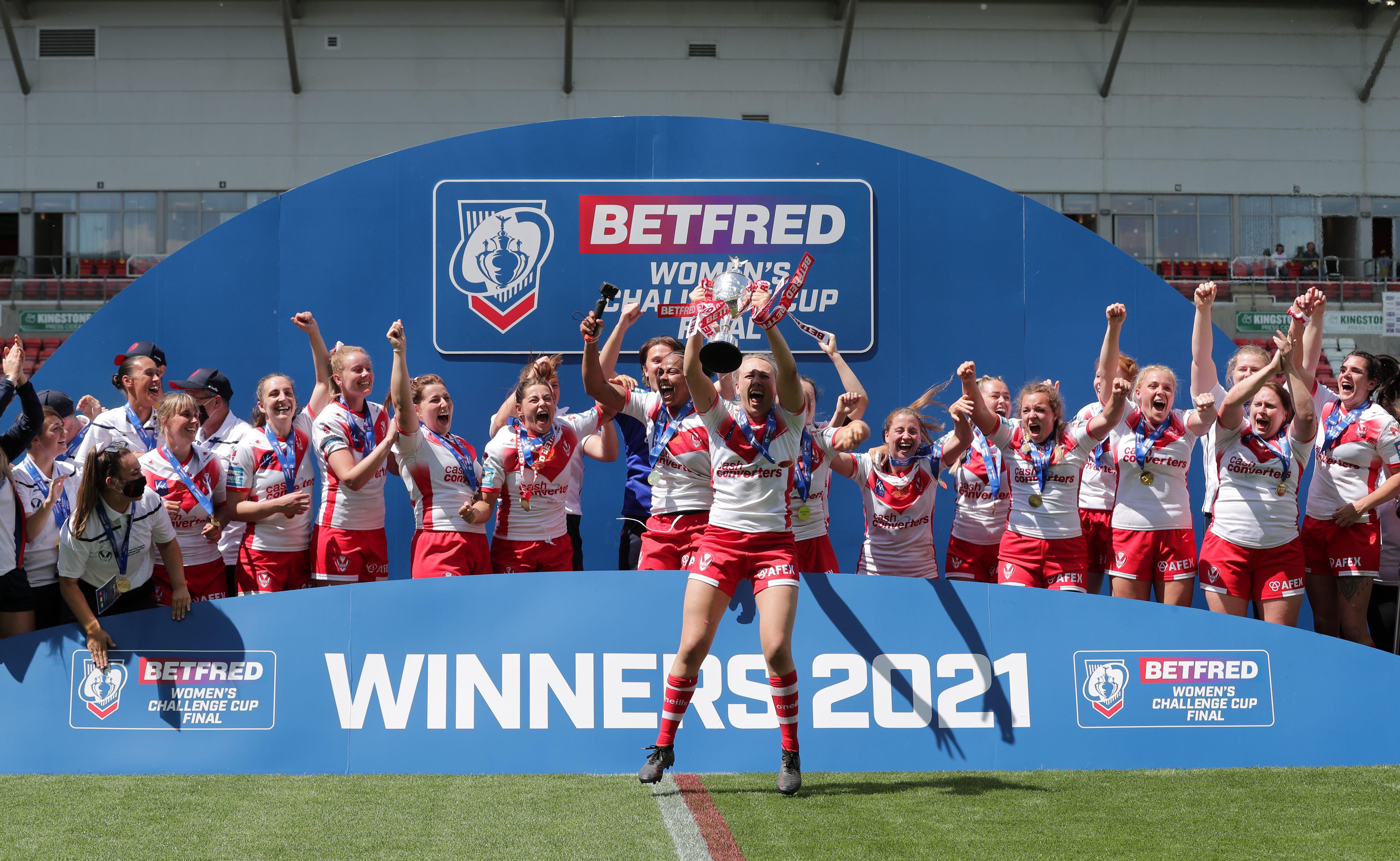 St Helens players celebrate winning the Women's Challenge Cup final match at the Leigh Sports Village, Manchester