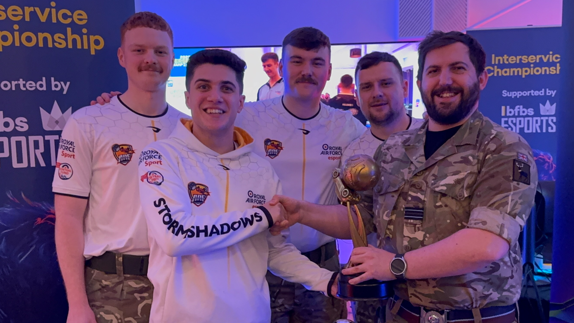 Stelios Elia, front left, receives the Inter Services Rocket League trophy on behalf of the RAF Stormshadows in December 2025 (Picture: BFBS)
