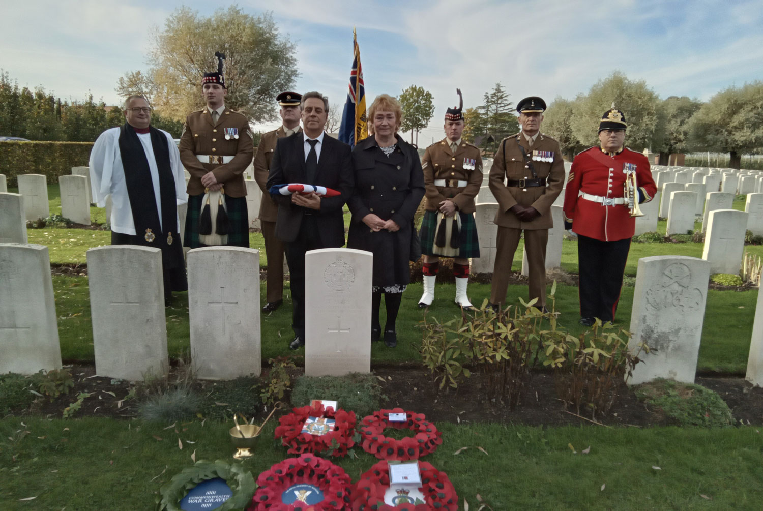 Stephen Gore, great nephew of Pte Parry is pictured with his wife Julie at the grave CREDIT Crown Copyright
