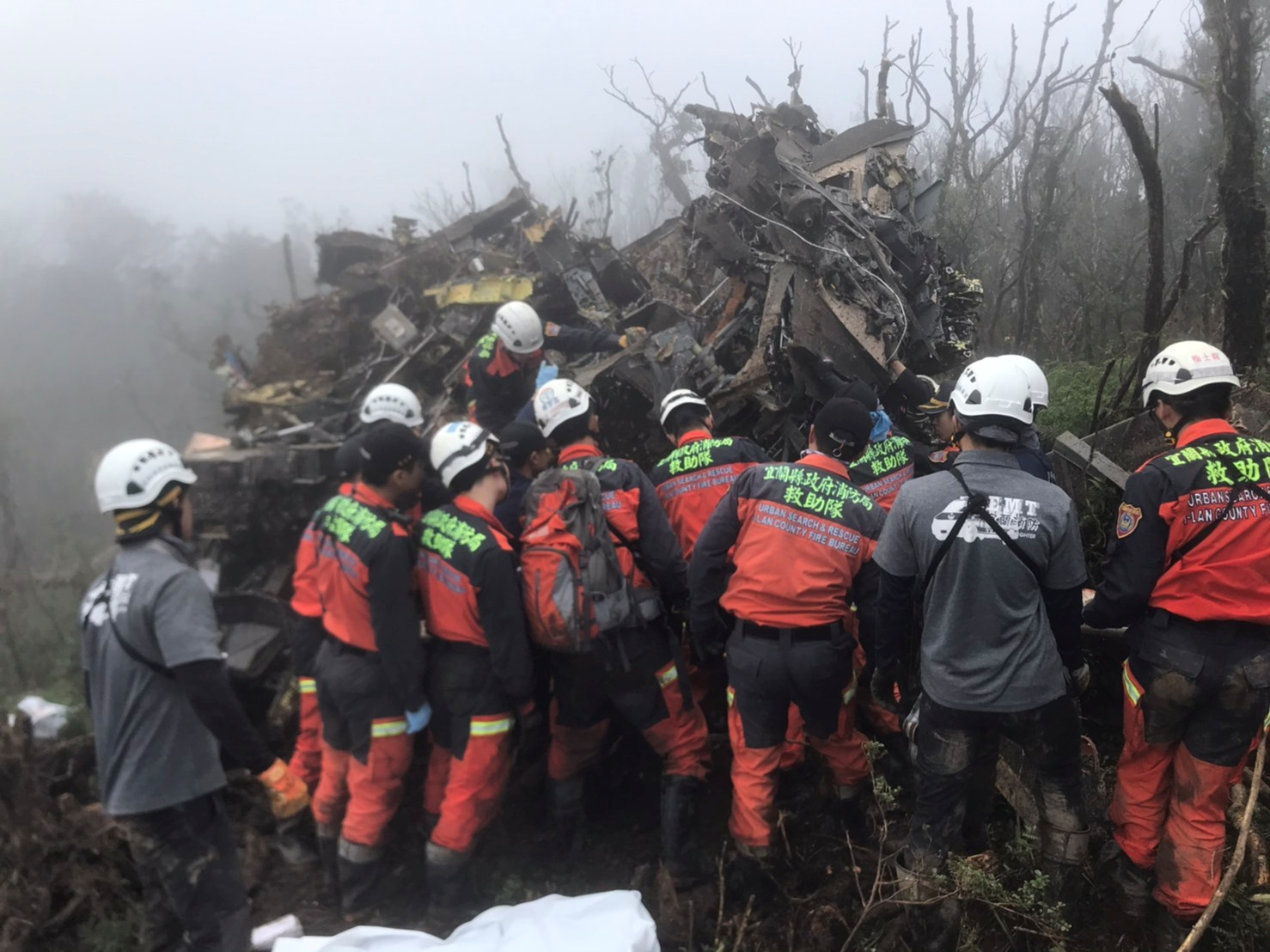 Search and rescue teams tending to the site of the crash (Picture: Reuters).