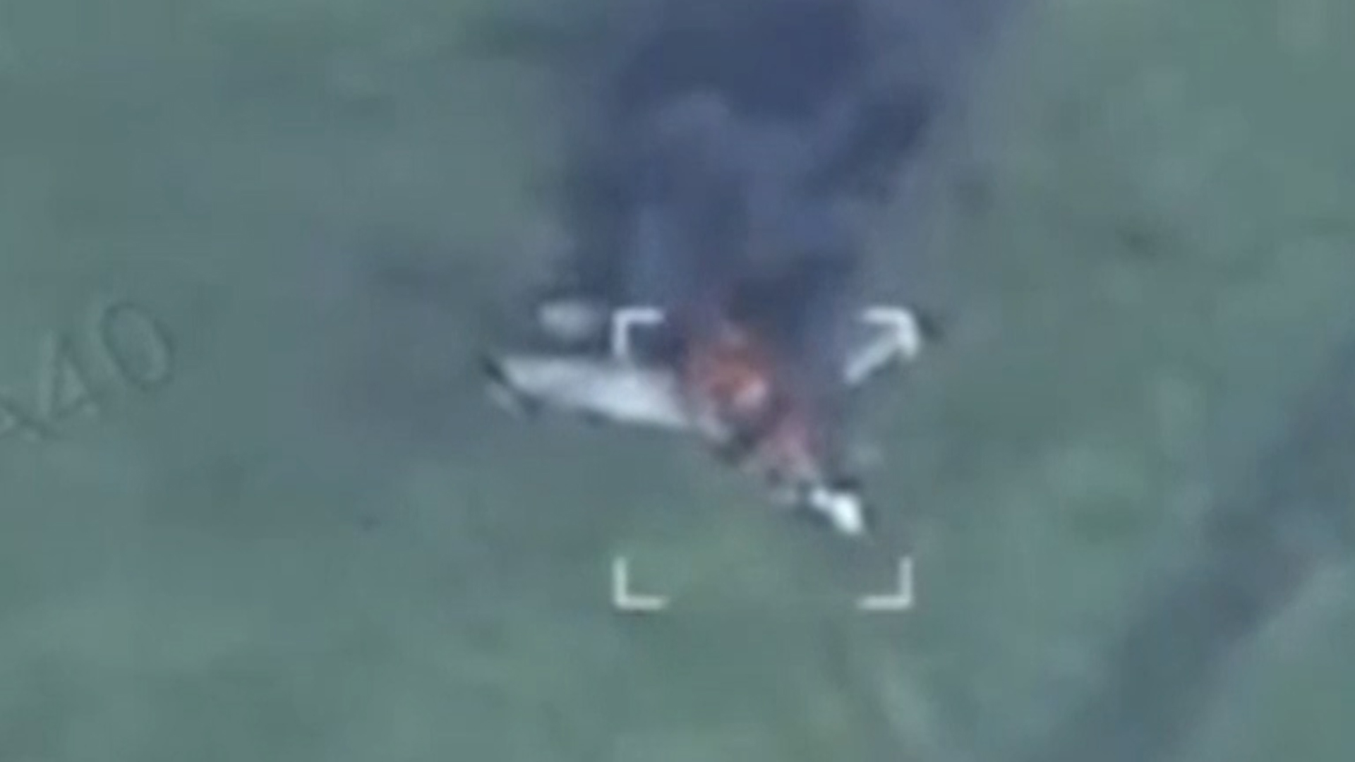 This image allegedly shows a Russian Su-35 in a field in the Kursk region of Russia, but the reason for its  destruction is unconfirmed (Picture: Ukrainian social media)