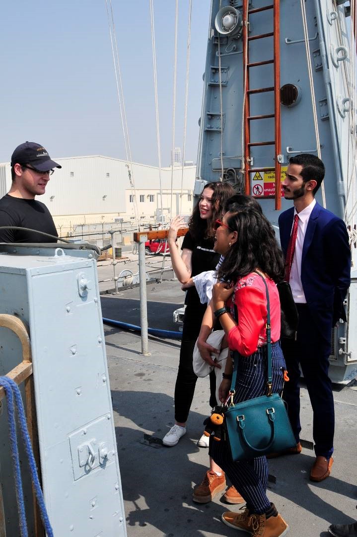 Sub-Lieutenant Chris Lewis with engineering students from Bahrain Polytechnic