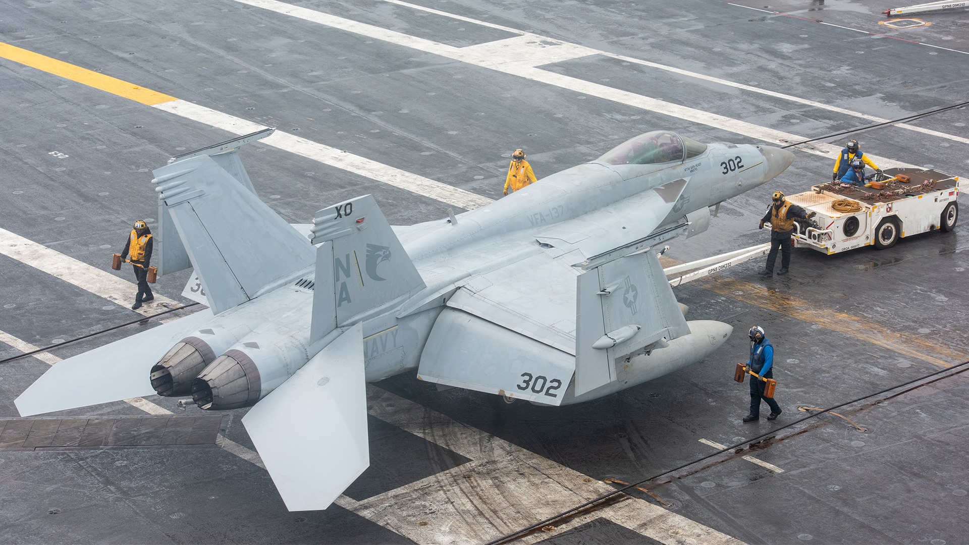 The incident involved an F/A-18E Super Hornet and tow tractor similar to these