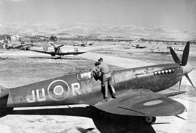 Supermarine Spitfires of 111 Squadron undergoing maintenance at Comiso, Sicily, in July 1943 CREDIT MOD