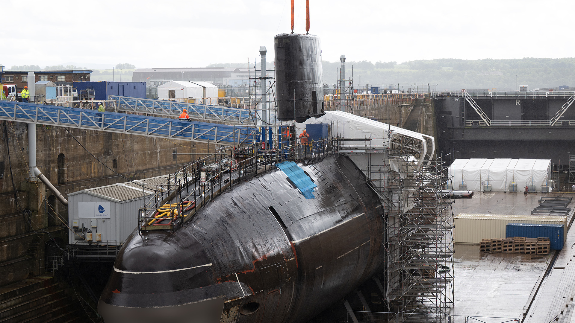 The fin is carefully lifted off Swiftsure to be recycled 