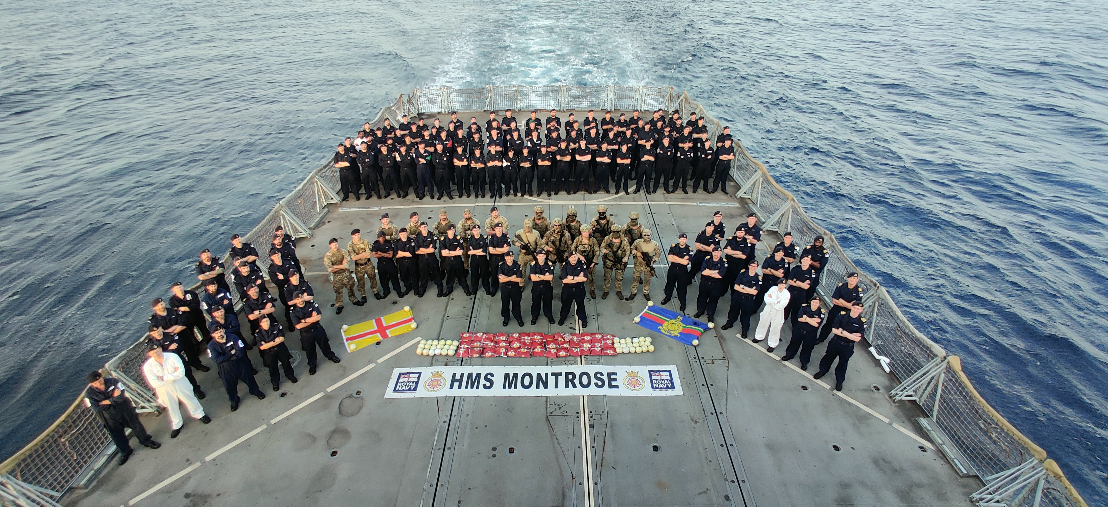 Team Montrose show off their drugs haul on the frigate's flight deck credit RN