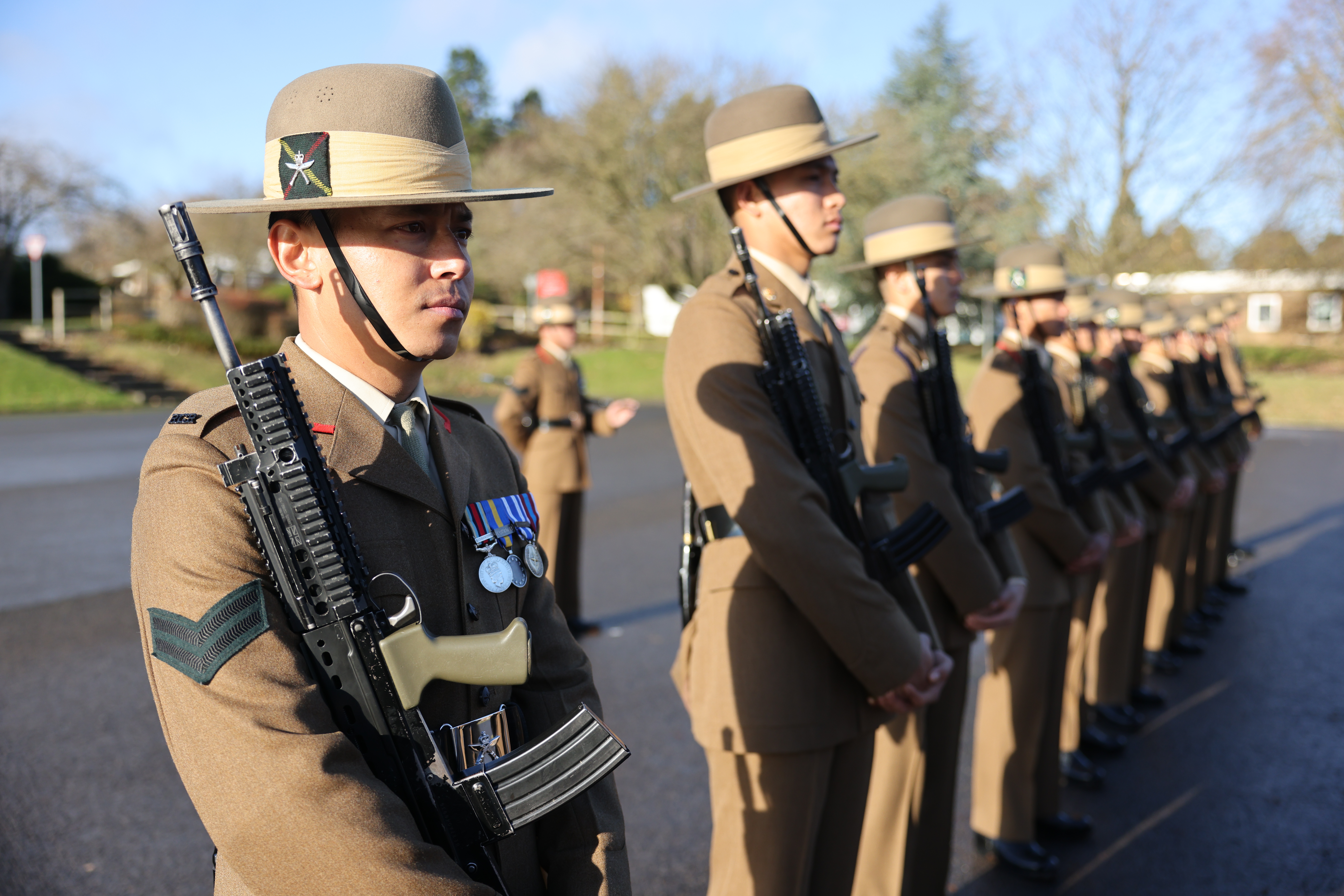 The British Army's newest Gurkhas stand to attention at a passing out parade following the completion of their initial training