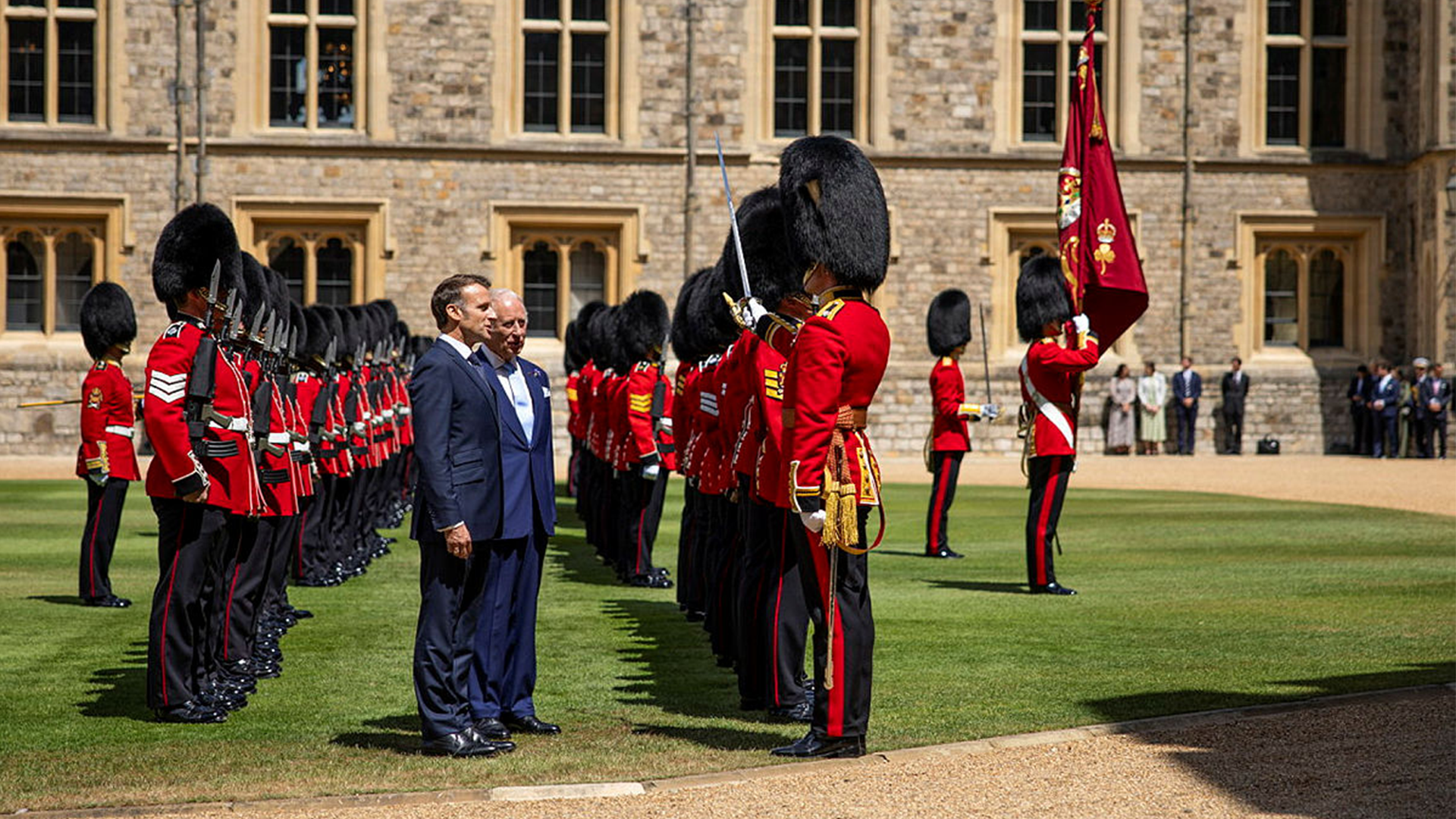 The Captain of the Guard, Major Jake Sayers, salutes the President of France Emmanuel Macron, after inspecting the Guard at Windsor Castle CREDIT MOD