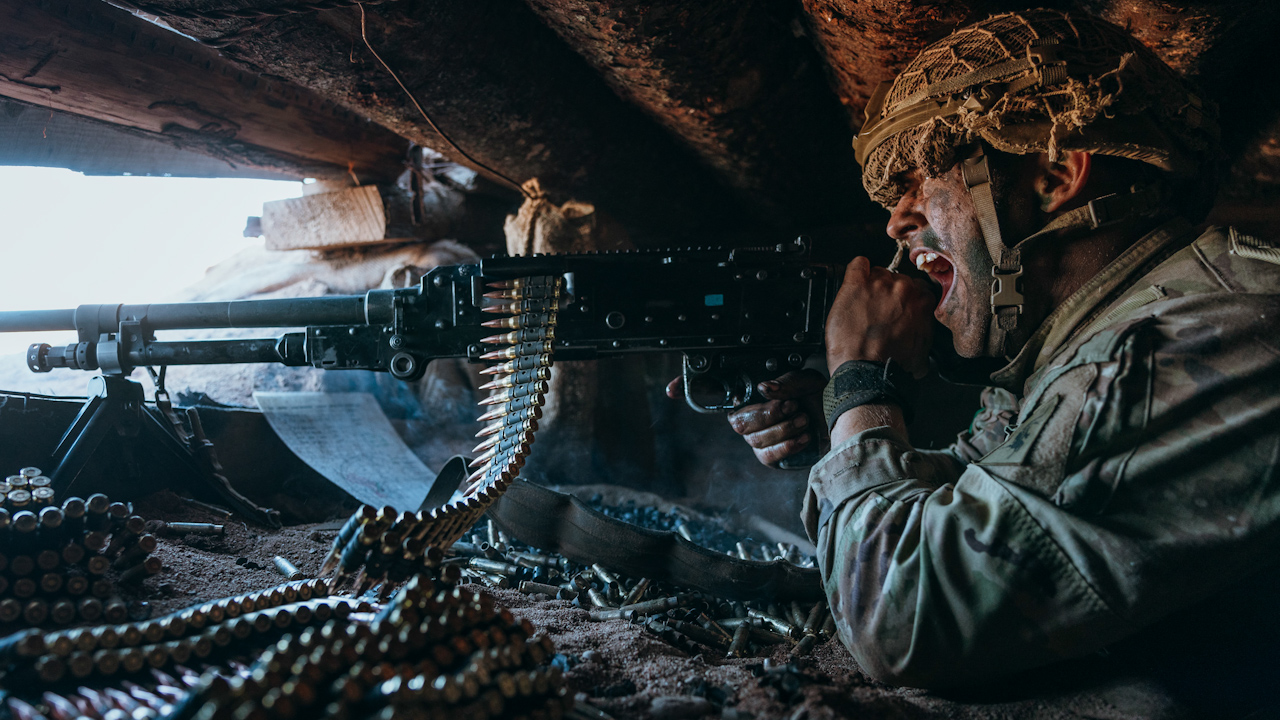 A Paratrooper using a General Purpose Machine Gun (GPMG) to defend the trench 3 PARA had just captured (Picture: British Army).