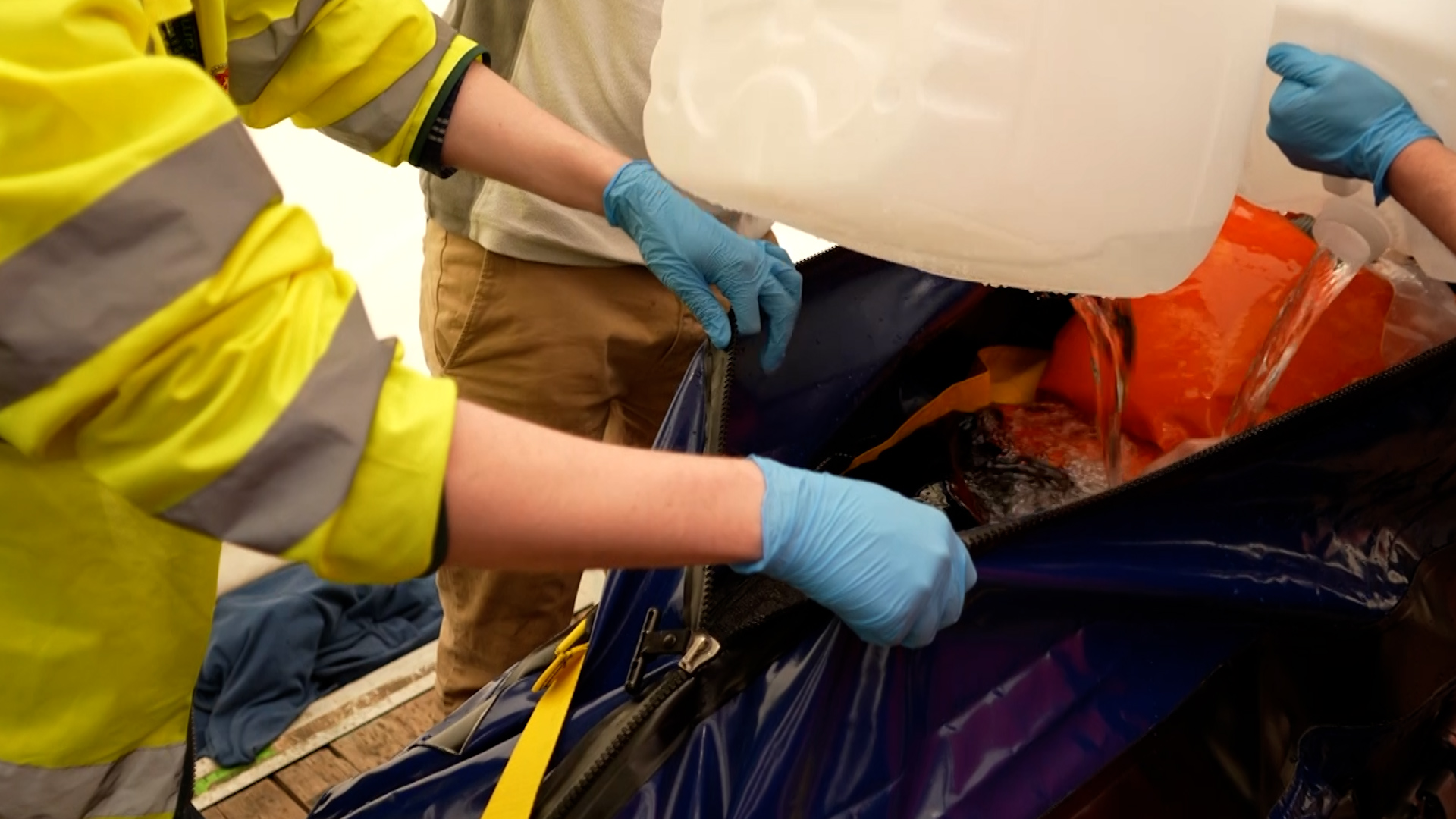 The I-CWIK, ice body bag, being filled up with ice cold water