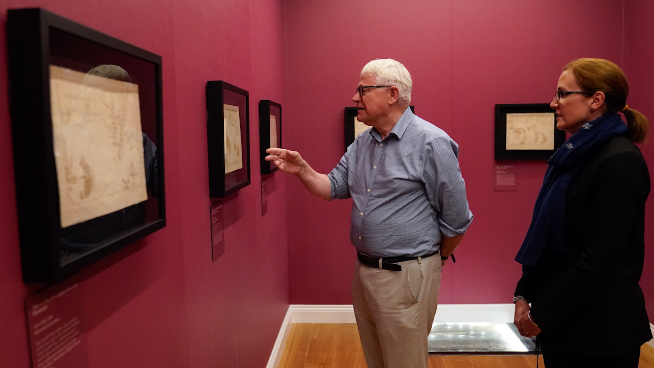 Professor Dominic Tweddle (left), and head of collections and research, Louisa Blight, looking at the rare collection of Spanish Armada Maps on display (Picture: PA Media).
