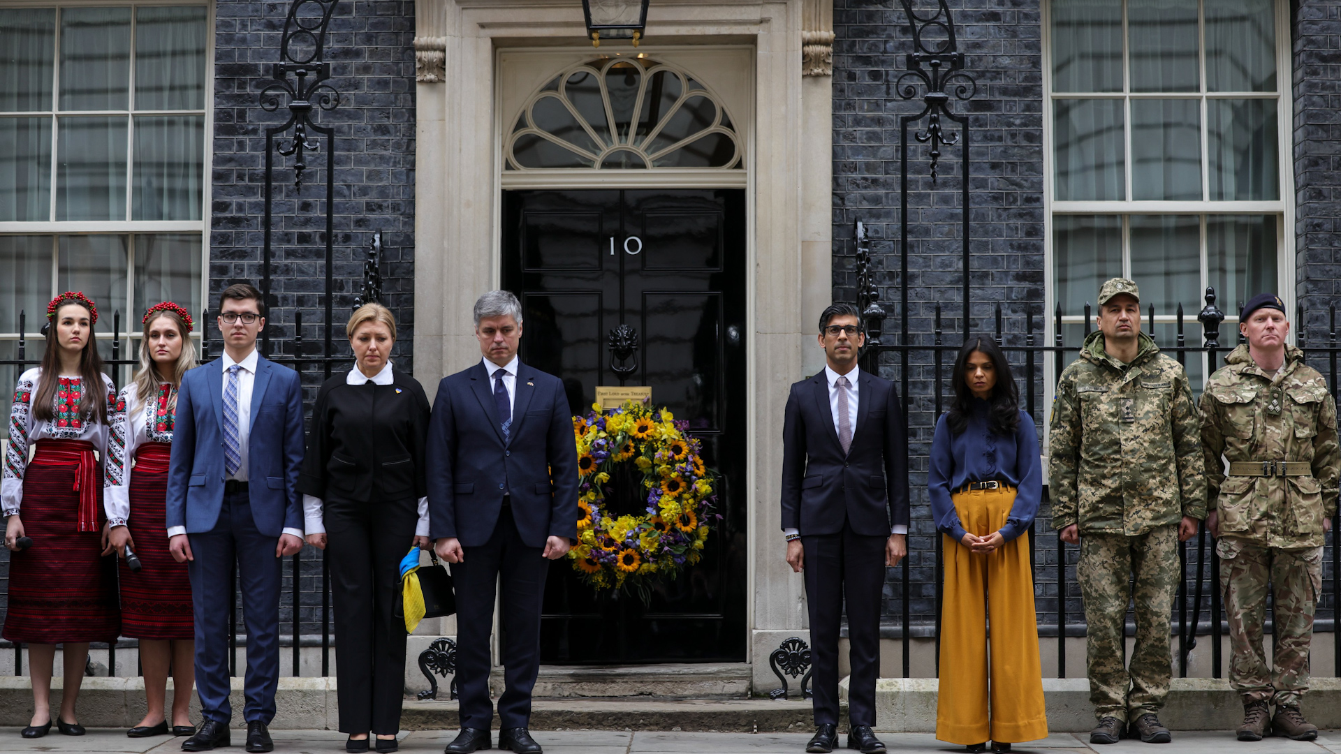 The Prime Minister observes a minute's silence outside Number 10 with his wife, Ukraine's ambassador to Britain and Ukrainian troops