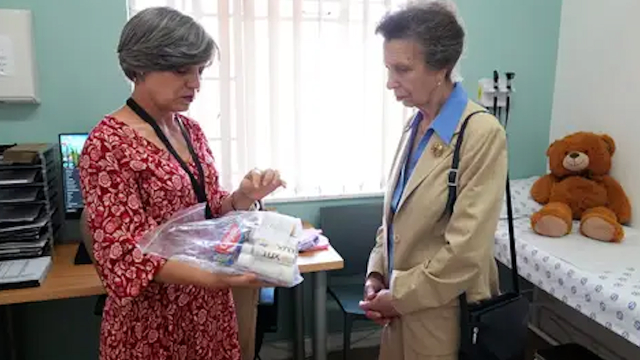 The Princess Royal is shown a care package by Dr Esme Swanepeol during a visit to the Thuthuzela Care Centre TCC (Picture: PA)