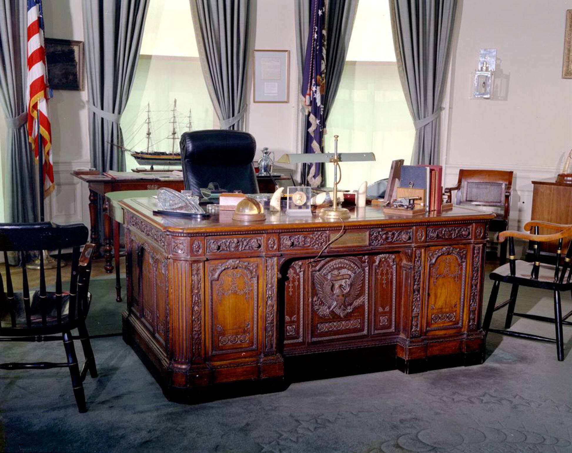 The Resolute desk from HMS Resolute timber in the Oval Office of the White House (Picture: Alamy).