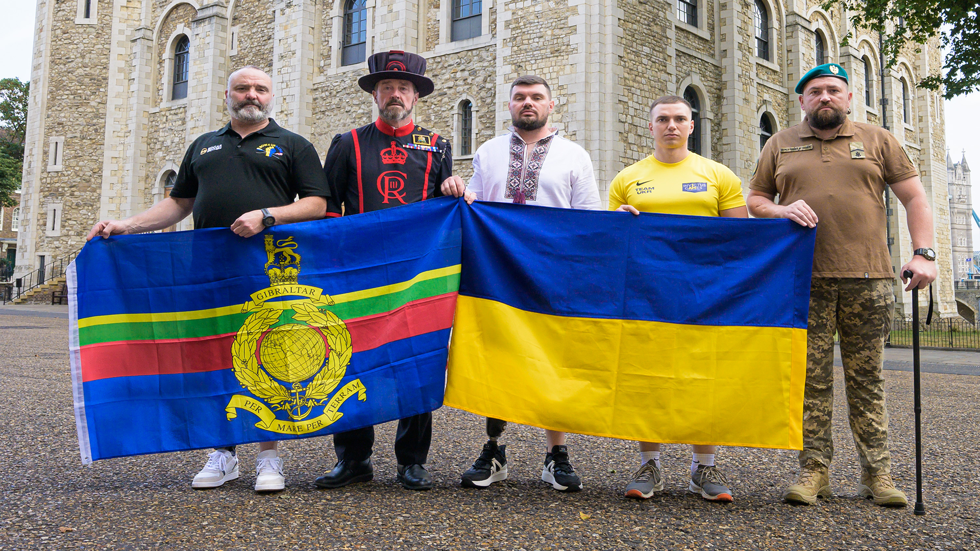 The Row4Ukraine team pose in front of the White Tower at the Tower of London CREDIT Ant Upton