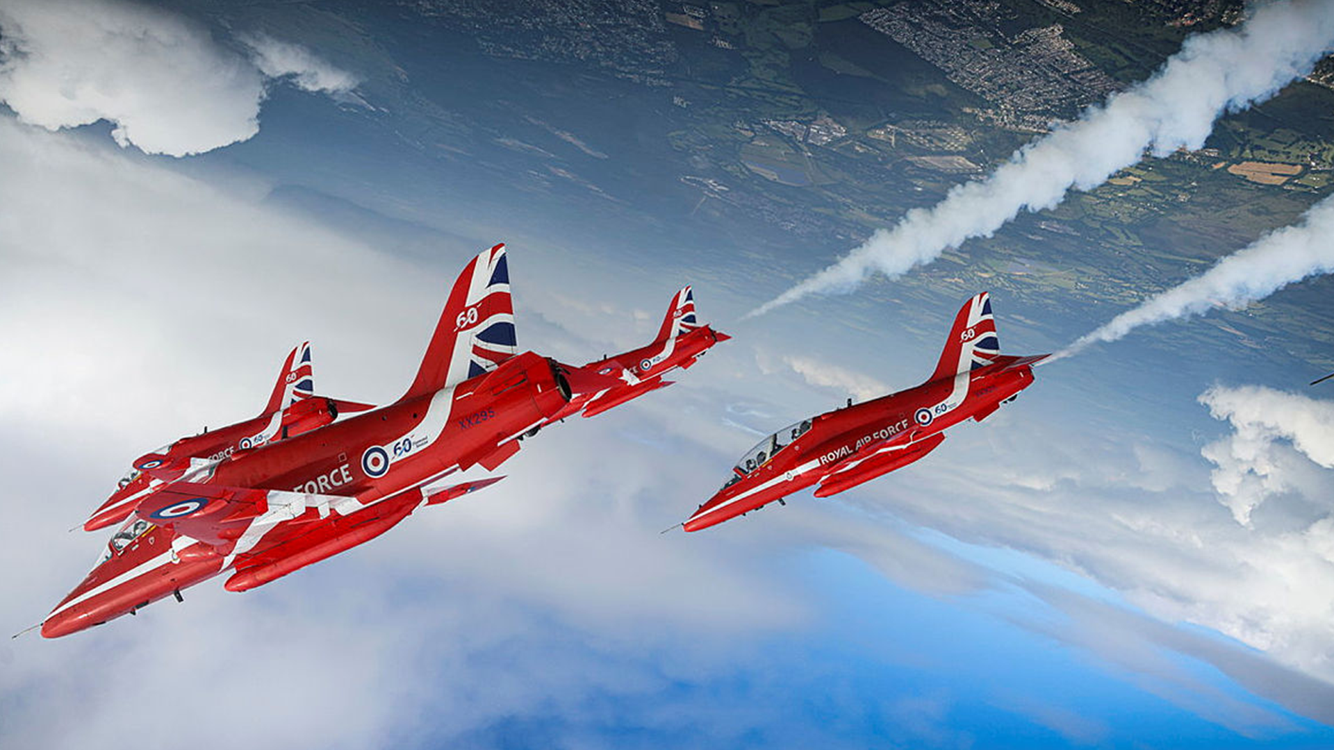 The Royal Air Force Aerobatic Team accompanied by Typhoon Display Team 'Moggy' aircraft fly over the British Normandy Memorial, Ver-sur-Mer CREDIT MOD 060624