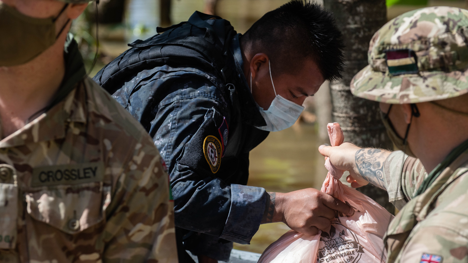 The troops have been wearing masks whilst providing aid (Picture: MOD).