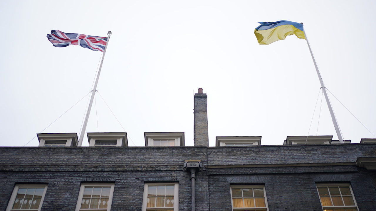The Union flag and the flag of Ukraine fly above Downing Street, London, following the announcement of a major new package of £2.5bn in military aid to Ukraine over the coming year (Picture: PA).