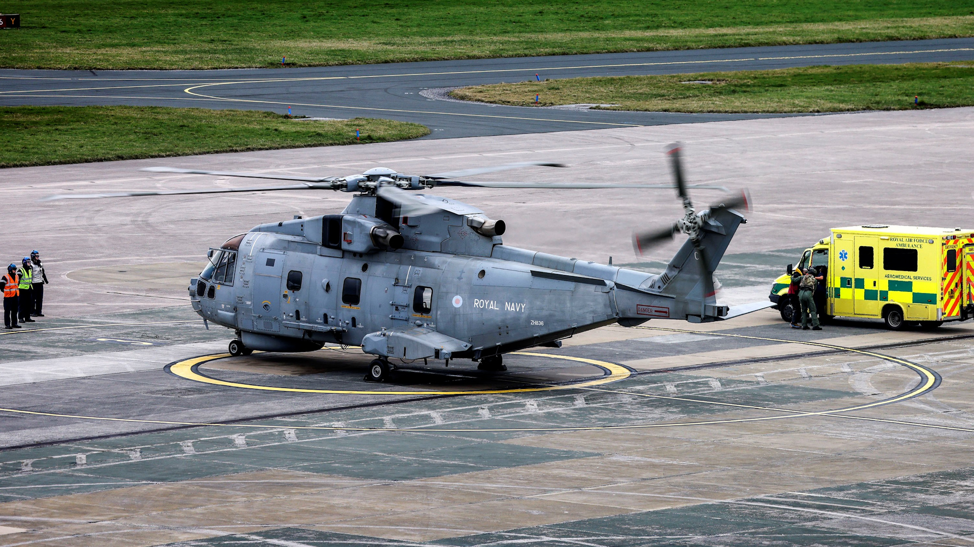 The aircrew hands over the rescued kayaker to the ambulance service (Picture: Royal Navy).