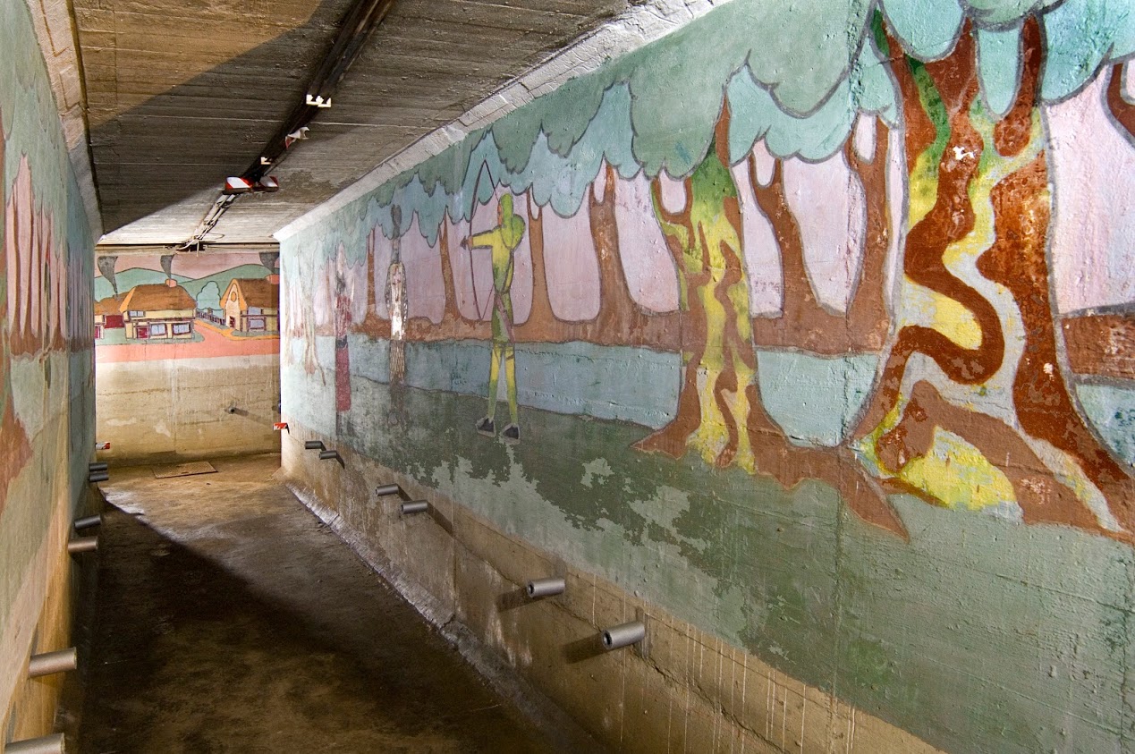 Cover image: TheSt John’s School boys' air raid shelter includes a number of murals, depicting scenes from stories such as Treaure Island and Robin Hood (Picture: Historic England Archive).