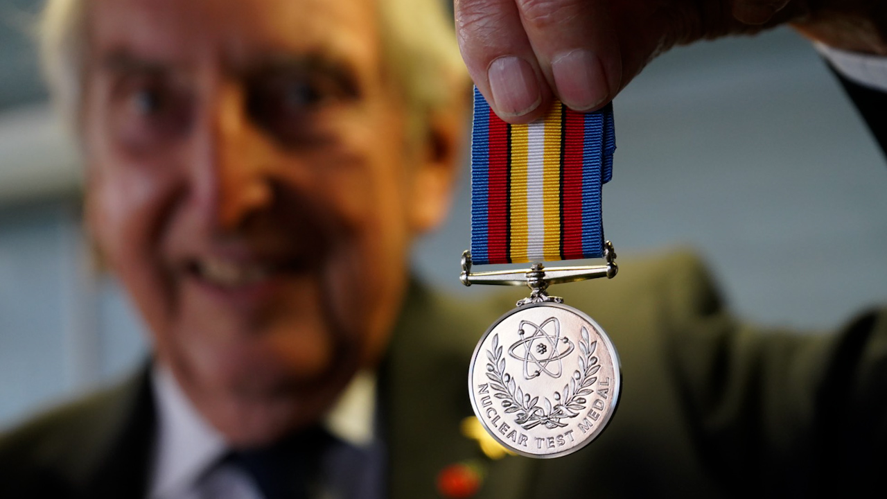 Veteran John Robinson was the first to hold the new Nuclear Test Medal (Picture: Johnny Mercer Twitter).