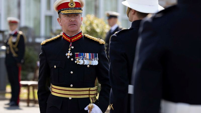 The outgoing CGRM Major General Matt Holmes CBE DSO inspects the guard at the supersession of the Commandant General Royal Marines