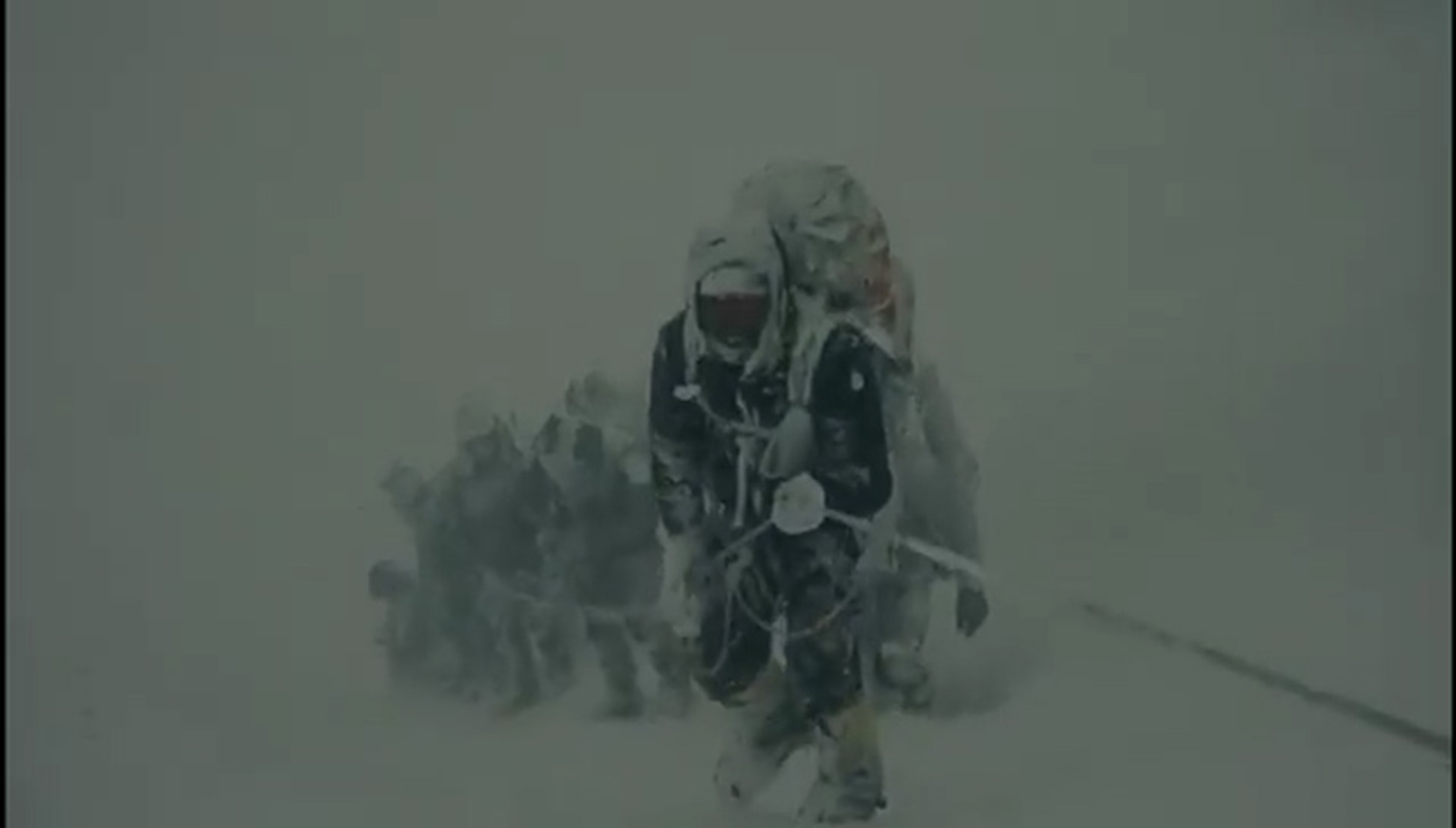 The group huddled down on the snow as the avalanche crashed down Mount Everest's rocks and ice (Picture: Al Carns' X)
