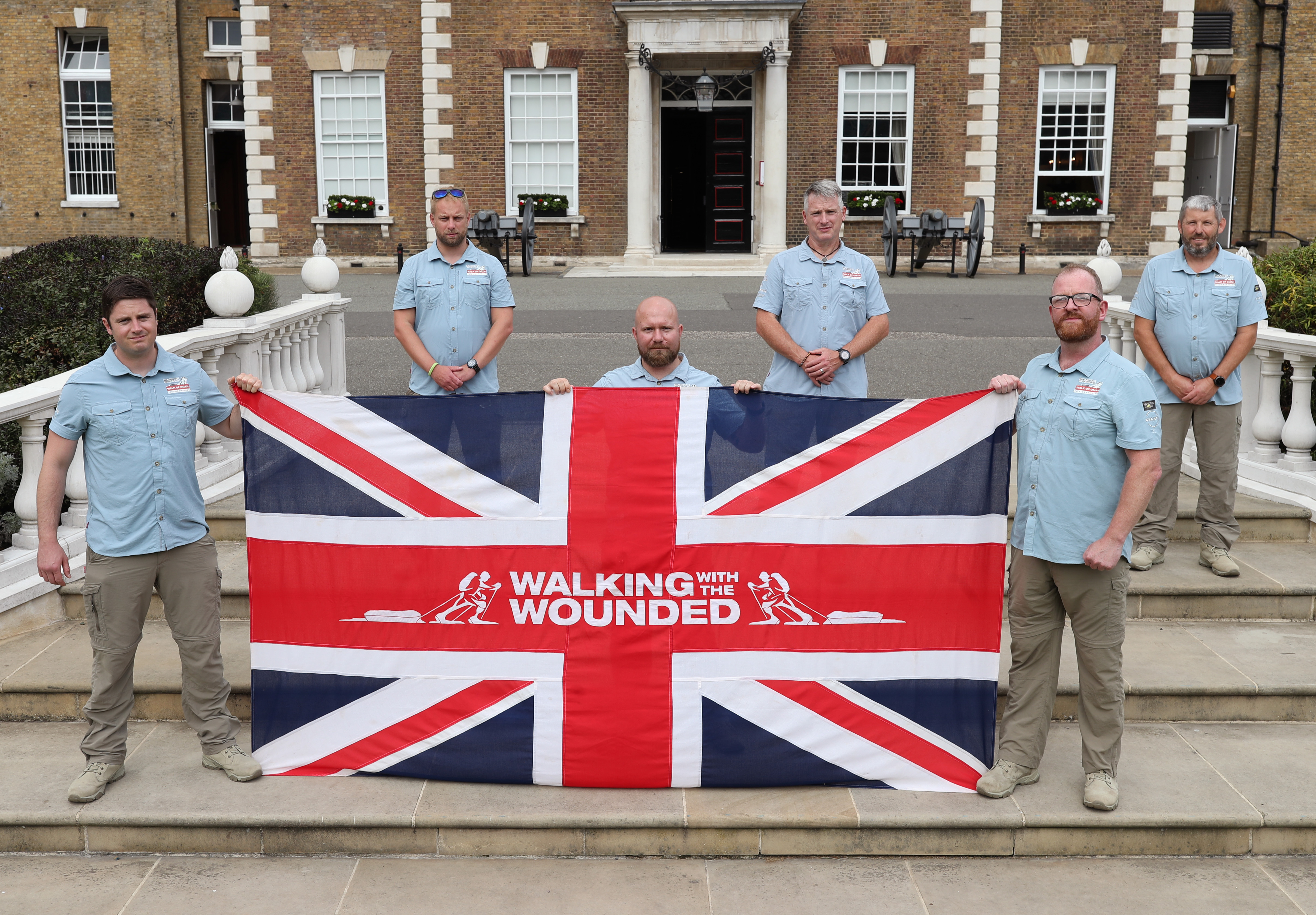 Cover image: Walking With The Wounded's Walk of Oman team pictured in September 2020 (Picture: PA).