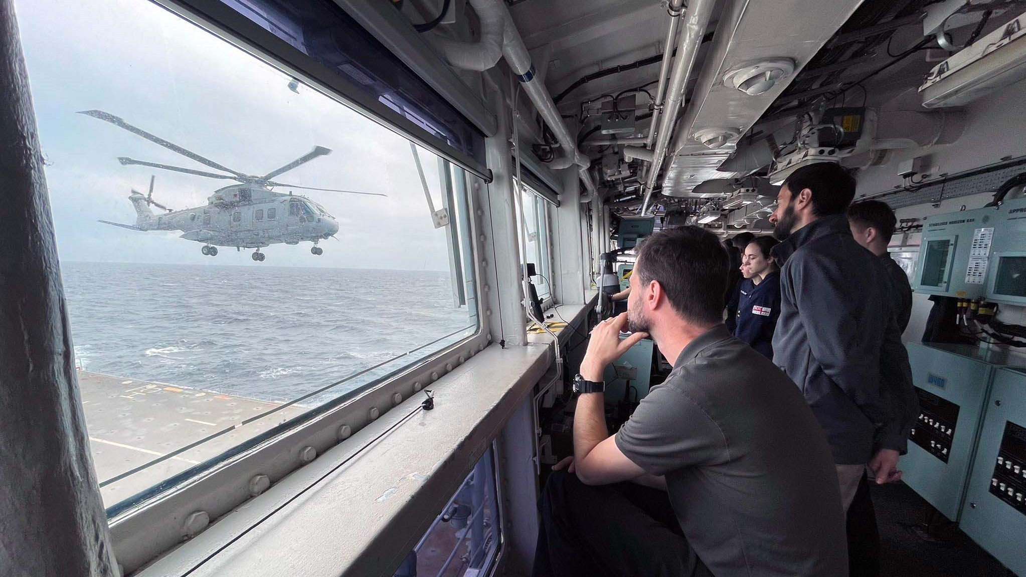 The trials team watch the Merlin come into land on HMS Albion 26072023 CREDIT Royal Navy.jpg