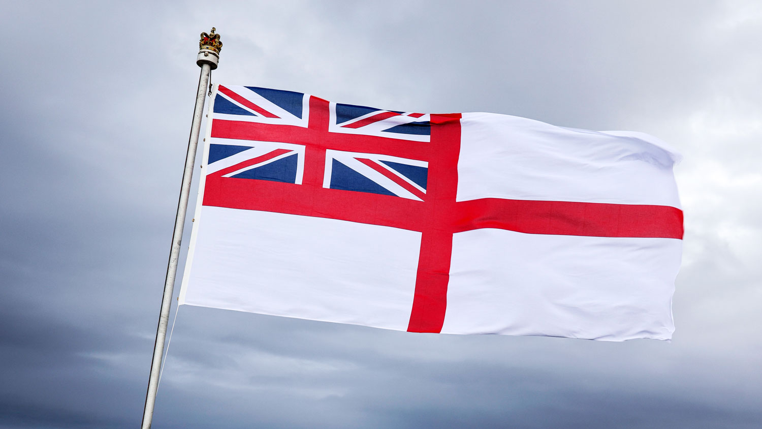 The white ensign flies while HMS Protector is alongside at Rothera, Antarctica December 2021 CREDIT Crown Copyright