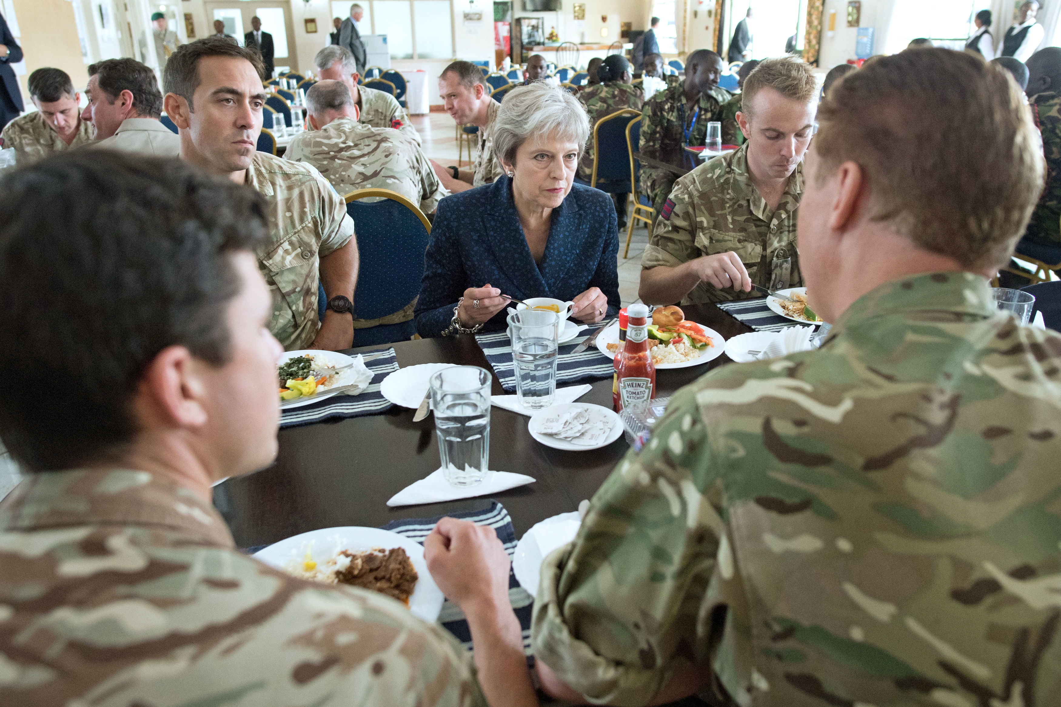 Theresa May eats lunch with British soldiers in Kenya CREDIT BFBS