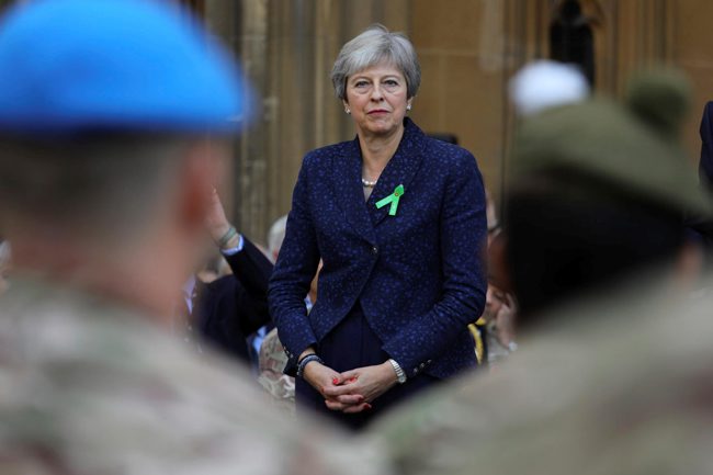 Theresa May greeting troops at parliament