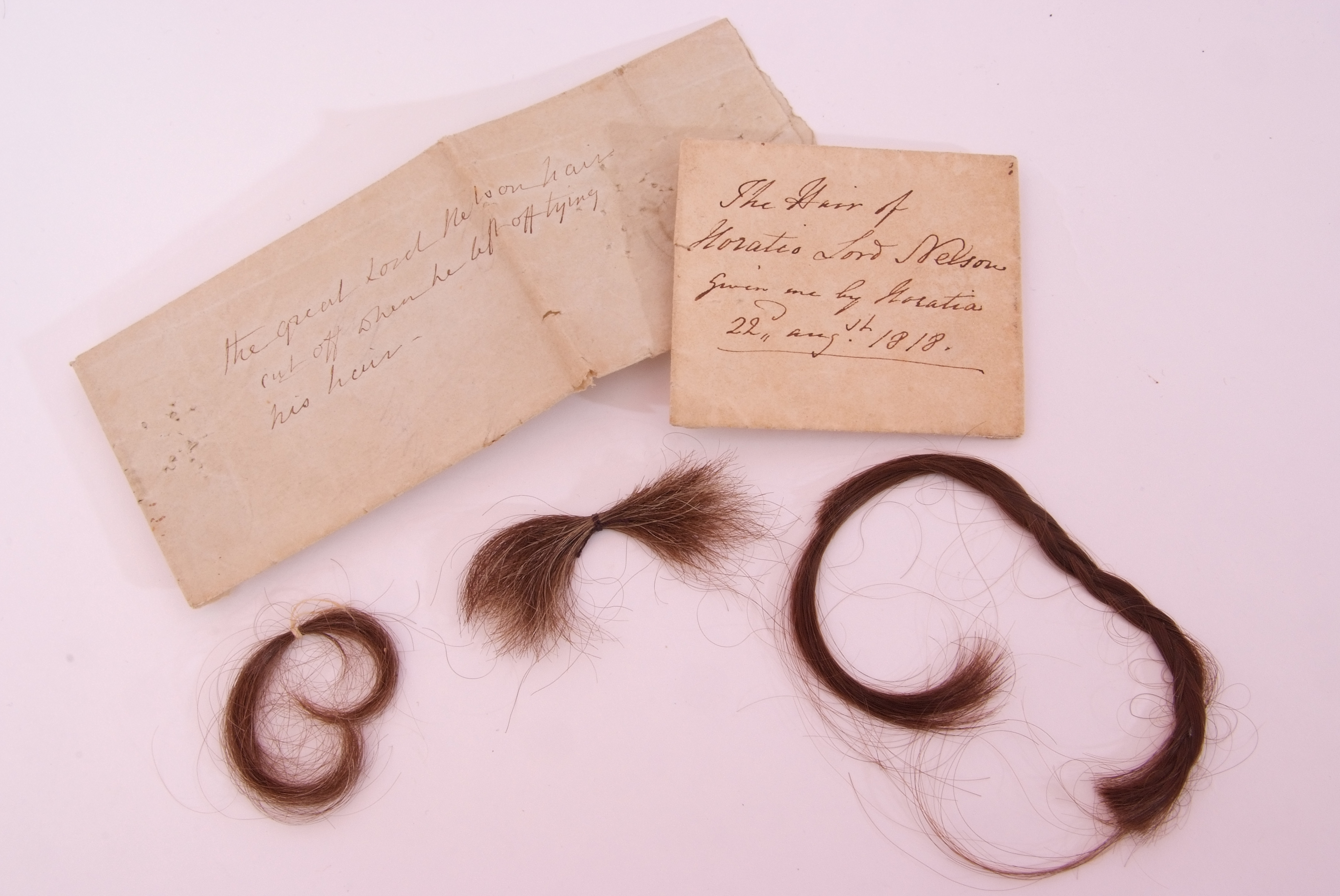 Three locks of Lord Nelson's sold for £5,278.34 including the buyer’s premiumin at auction. They are kept in inscribed paper packets 310720 CREDIT Keys Auctioneers and Valuers