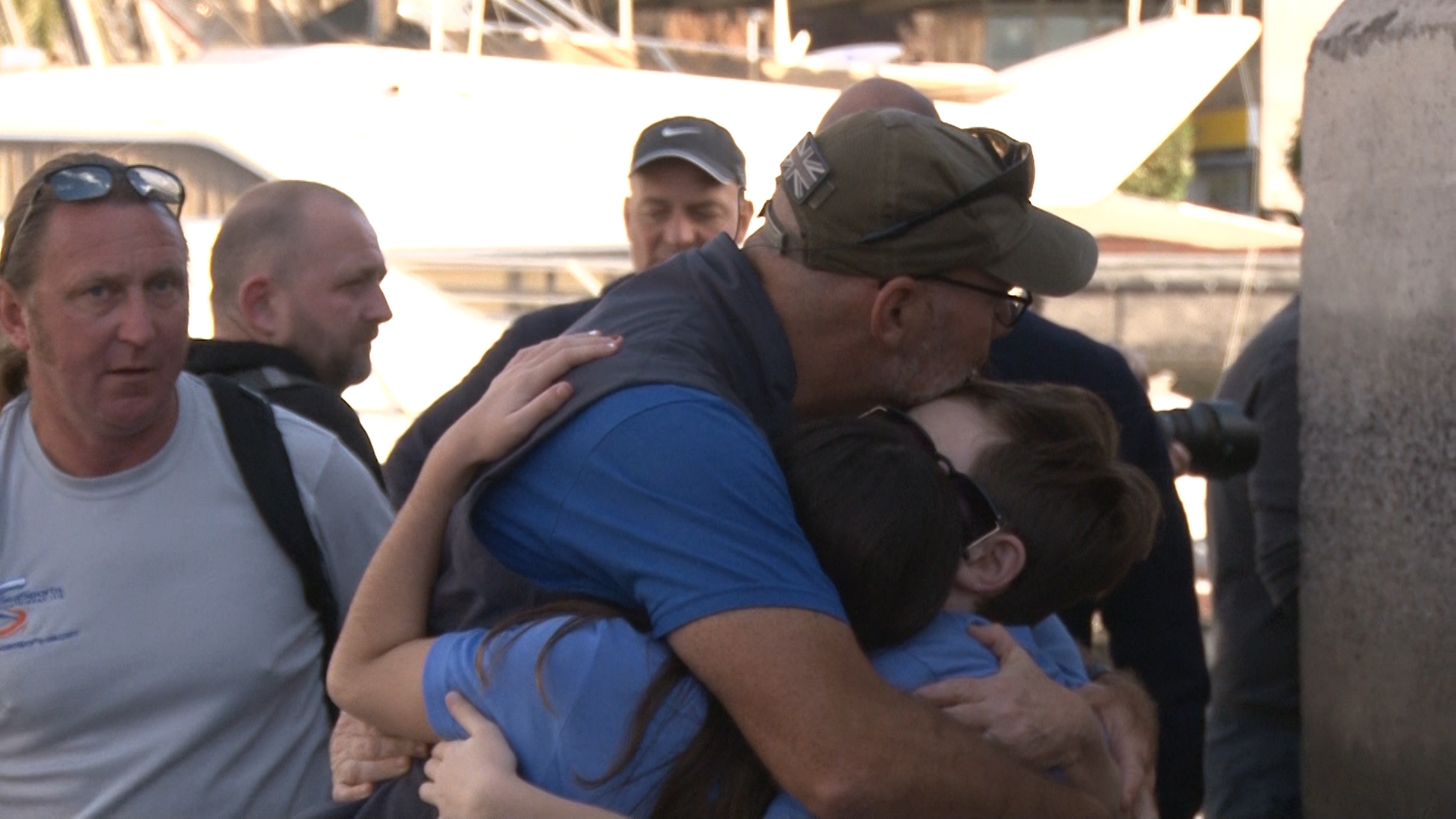 Tim Crockett hugs his family goodbye before starting the race.