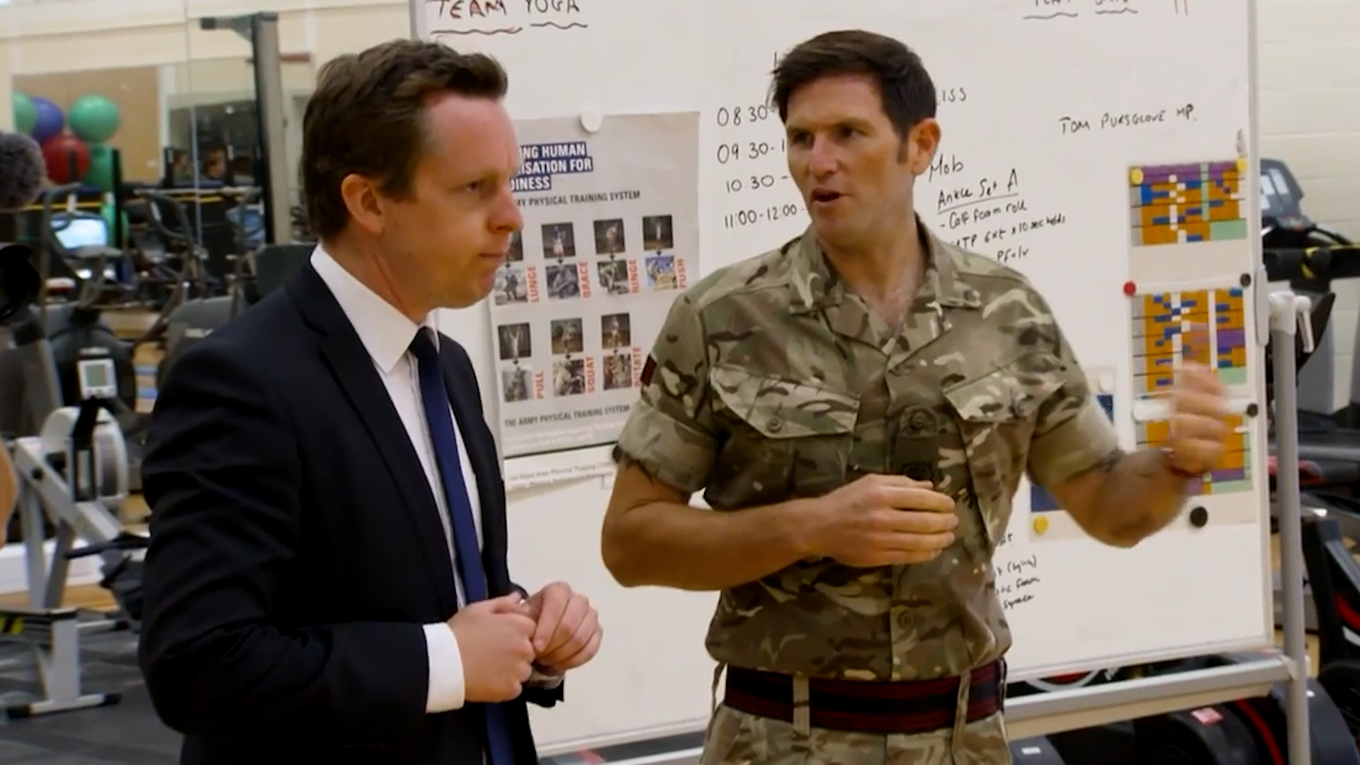 Tom Pursglove, Minister For Disabled People, Health And Work speaks to a soldier at a rehabilitation centre CREDIT BFBS.jpg