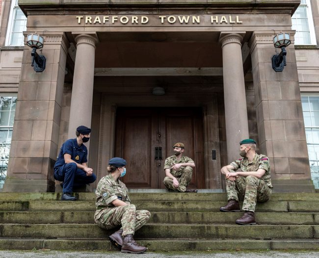 Reservists from the Royal Navy, British Army, RAF and Royal Marines outside Trafford Town Hall (Picture: MOD).