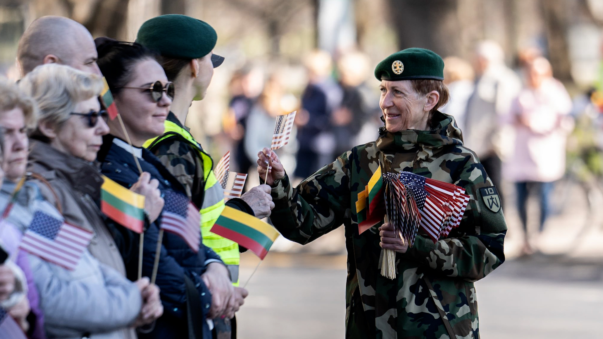 People waved US and Lithuanian flags