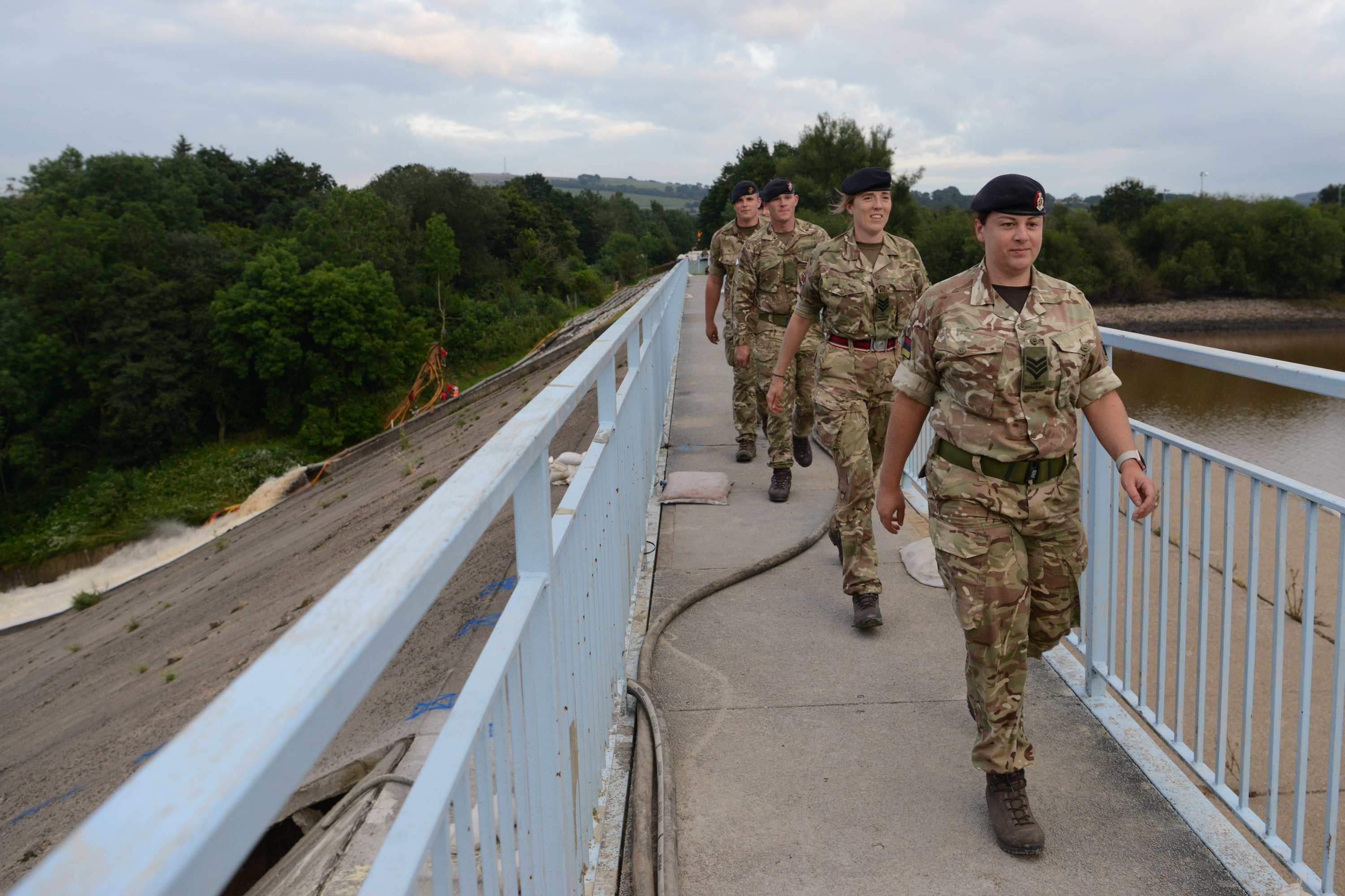 Soldiers walk across Whaley Bridge Dam (Picture: MOD).