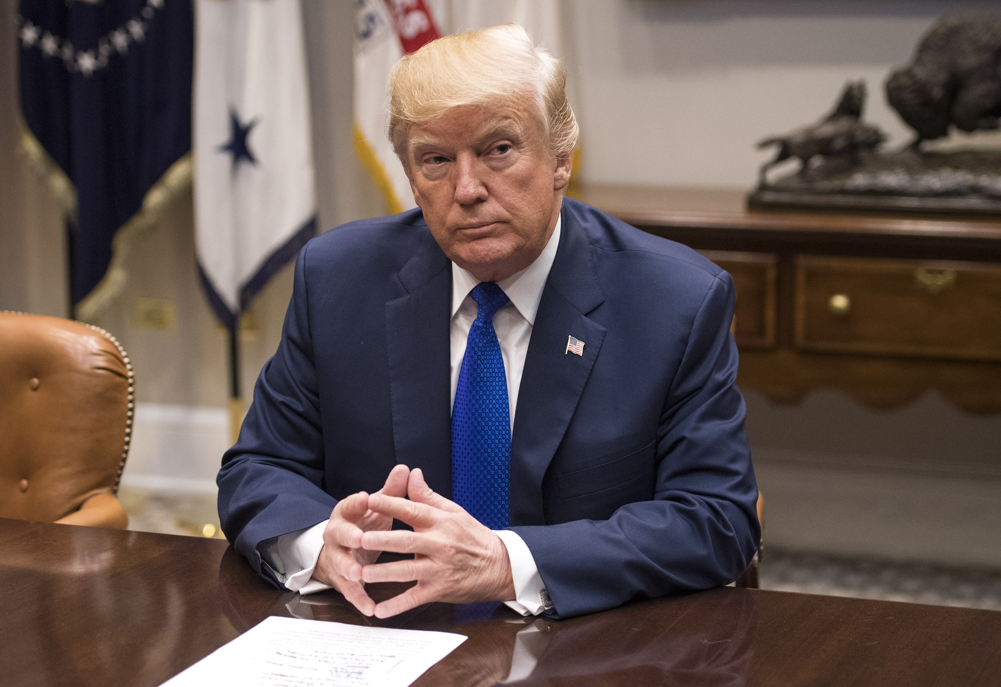 US President Donald Trump reacts to latest North Korean missile test