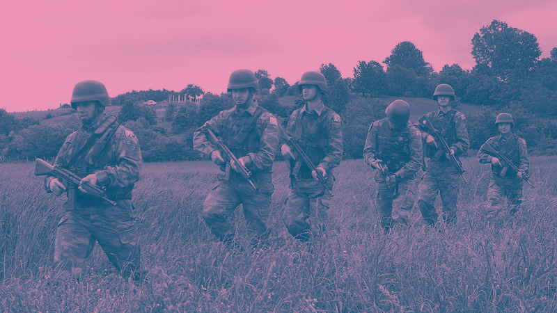 Turkish soldiers walking on grass in duotone style
